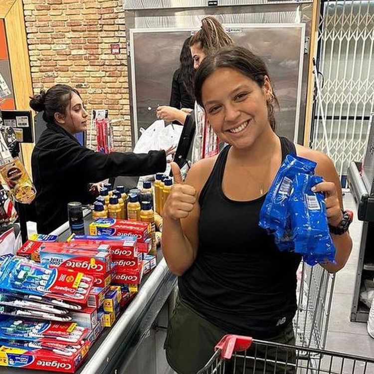 woman holds donated supplies